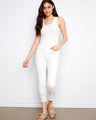 White slim-fit jeans in stretch denim with unique embroidered hem by Charlie B.