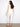 Five-pocket white jeans with intricate embroidery for added flair by Charlie B.