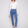 Medium blue jeans with a slim leg fit, featuring ankle-length cut and stylish embroidered hem by Charlie B.