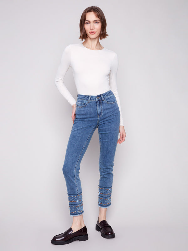 These medium blue jeans offer an exquisite blend of fashion and comfort with their stretch denim material by Charlie B.