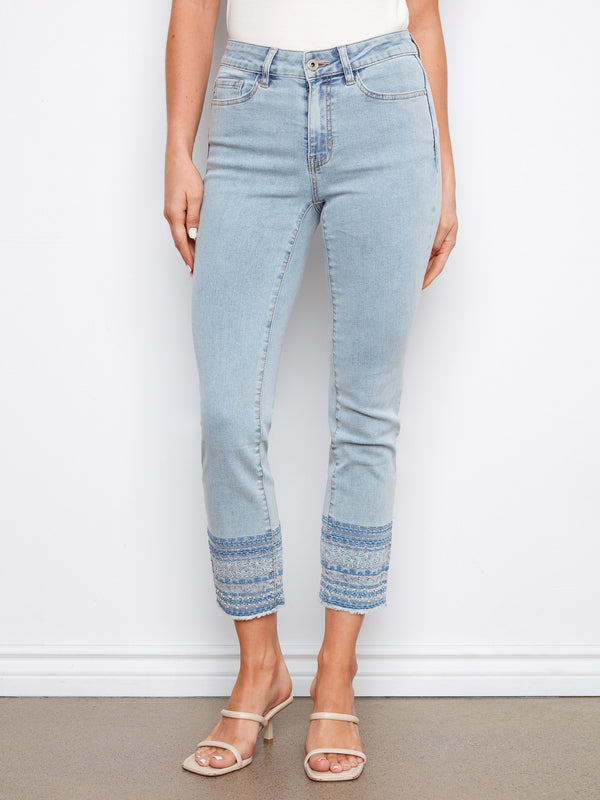 Embroidered hem detail adds a unique touch to these slim fit, stretch denim jeans for standout fashion. By Charlie B.