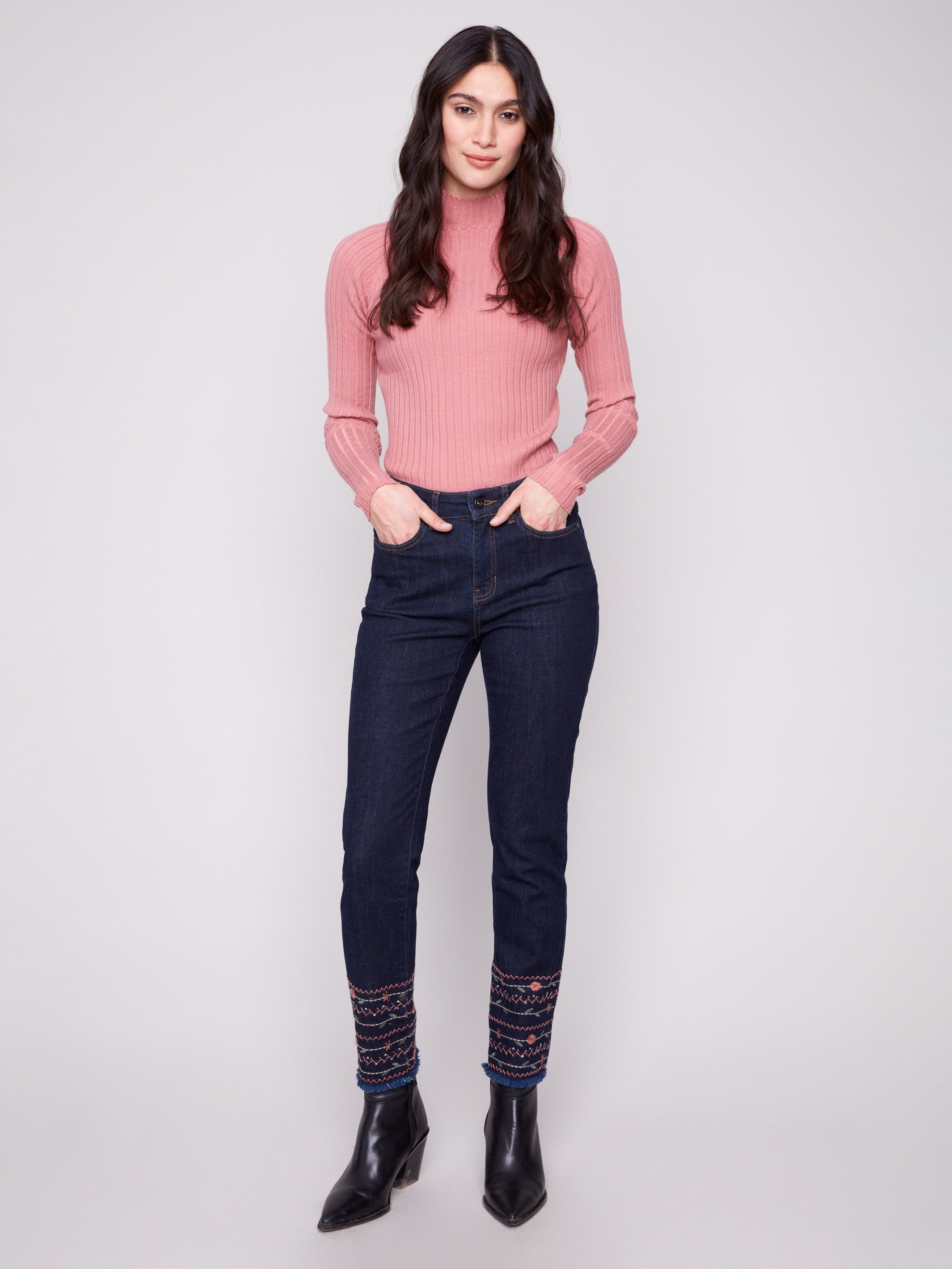 Ankle-length jeans in deep blue with intricate embroidered hem, offering a stylish touch and comfortable fit by Charlie B.