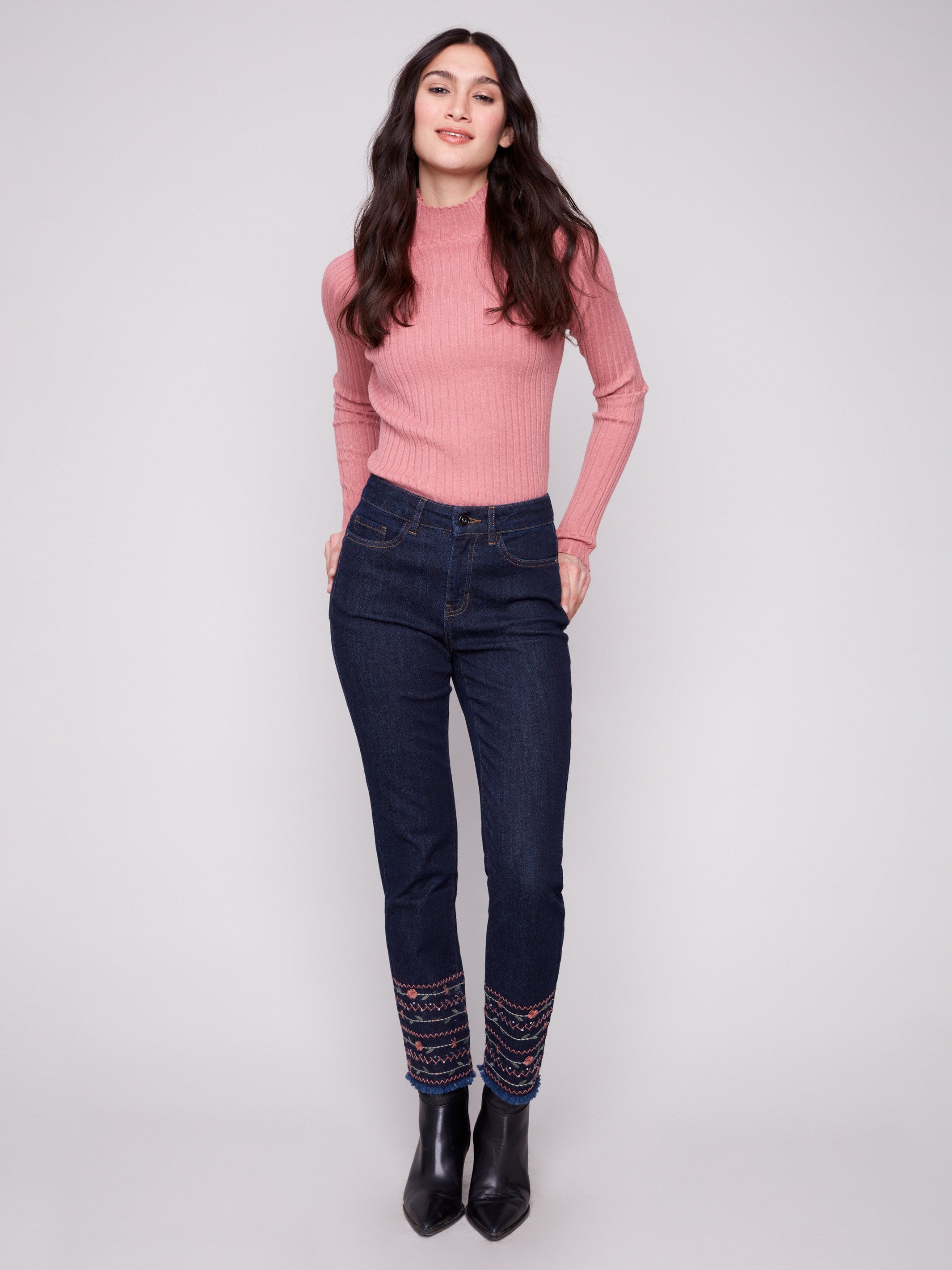 Regular rise slim leg jeans in deep blue with unique embroidered hem details for a chic look by Charlie B.