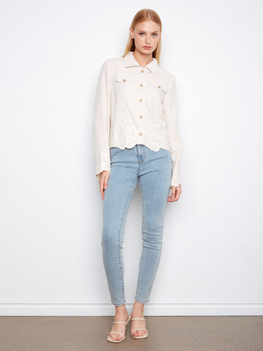 The front button closure of this jacket provides both functionality and style, making it a wardrobe essential by Charlie B.