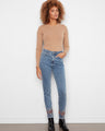 Medium blue slim leg jeans with stretch denim and intricate embroidered hem, featuring classic five-pocket style by Charlie B.