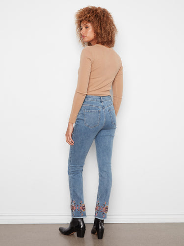 Embroidered hem enhances these slim fit medium blue jeans, designed with an ankle length cut for a modern look by Charlie B.