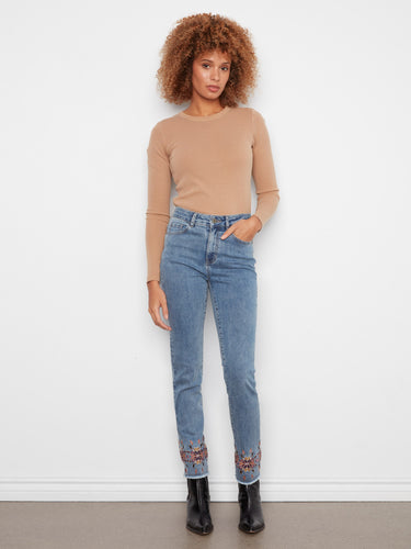 Slim leg jeans featuring a five-pocket design and intricate embroidery at the hem for added flair by Charlie B.