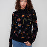 Elegant black sweater with intricate embroidered floral details, perfect for a chic look by Charlie B.