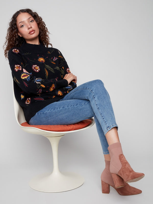 Stylish long sleeve black sweater featuring vibrant embroidery, adding flair to any outfit by Charlie B.