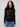 Black sweater adorned with colorful floral embroidery and comfortable long sleeves by Charlie B.