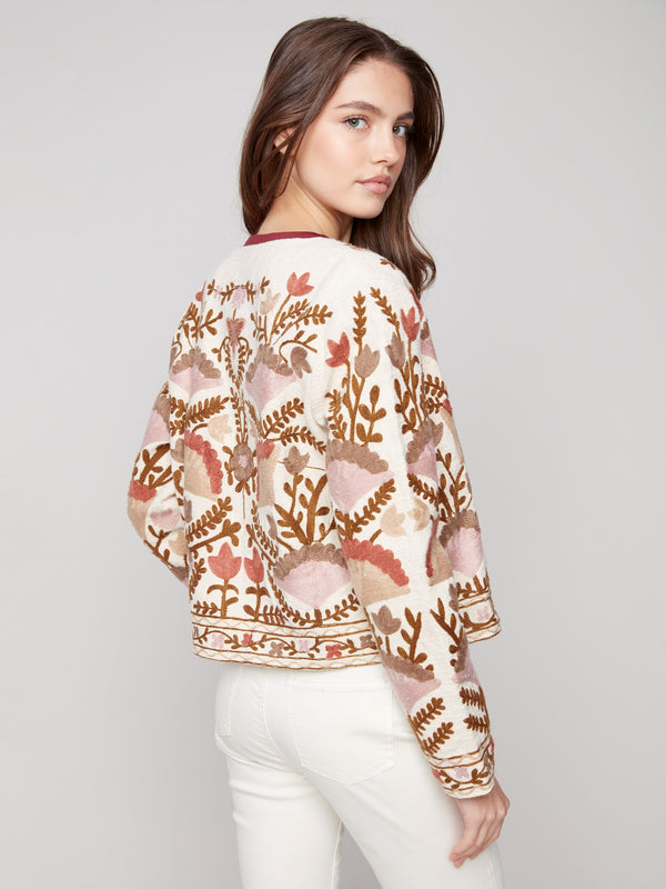 This open front design adds a touch of elegance to the embroidered jacket, crafted from premium materials by Charlie B.