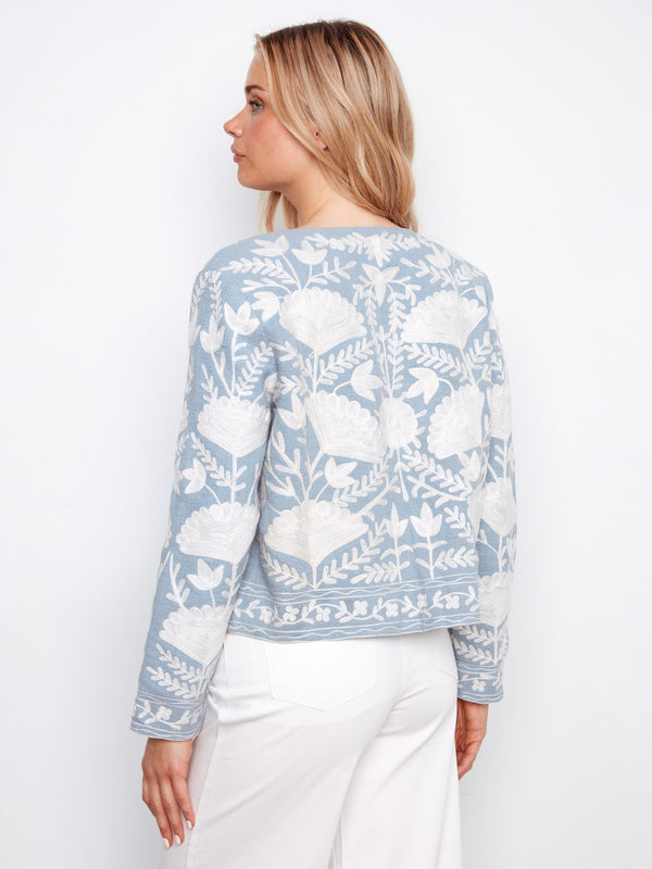 Embroidered open-front jacket in light blue with short length and elegant floral pattern by Charlie B.