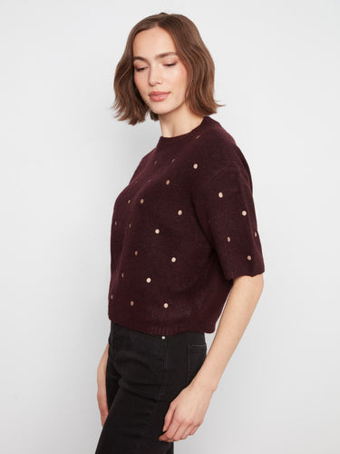 Elegant balloon elbow sleeves on a heather-wine knit with playful embroidered dots by Charlie B.