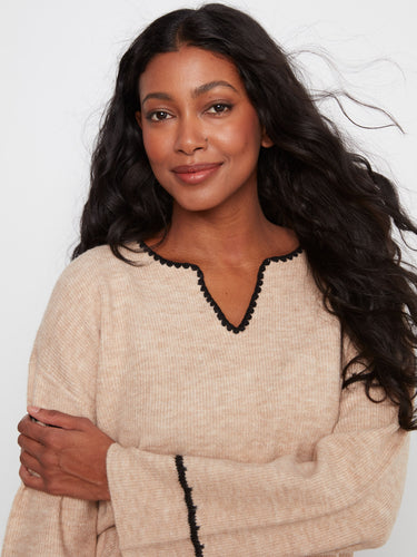 Crafted with ribbed knit texture, this sweater offers both style and cozy comfort, perfect for everyday wear. By Charlie B.