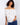 Stylish off-the-shoulder top adorned with blue floral embroidery and elastic hem by Charlie B.