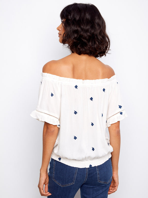 Casual chic white blouse featuring an elastic hem, perfect for any occasion by Charlie B.
