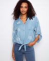 Blue blouse with floral embroidery and a collared V-neckline, highlighted by a chest pocket for added style by Charlie B.