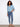 Elegant blue blouse featuring button-down front and floral patterns, complete with 3/4 roll-up sleeves by Charlie B.
