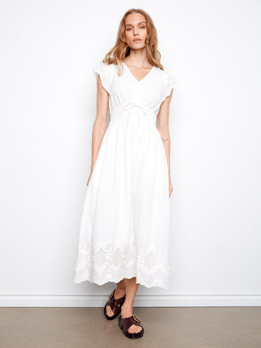 Stylish white dress showcasing a V-neck design and ruffle cap sleeves for a feminine look by Charlie B.