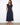 The dress features an empire elastic waist, adding a flattering silhouette for various body types. By Charlie B.