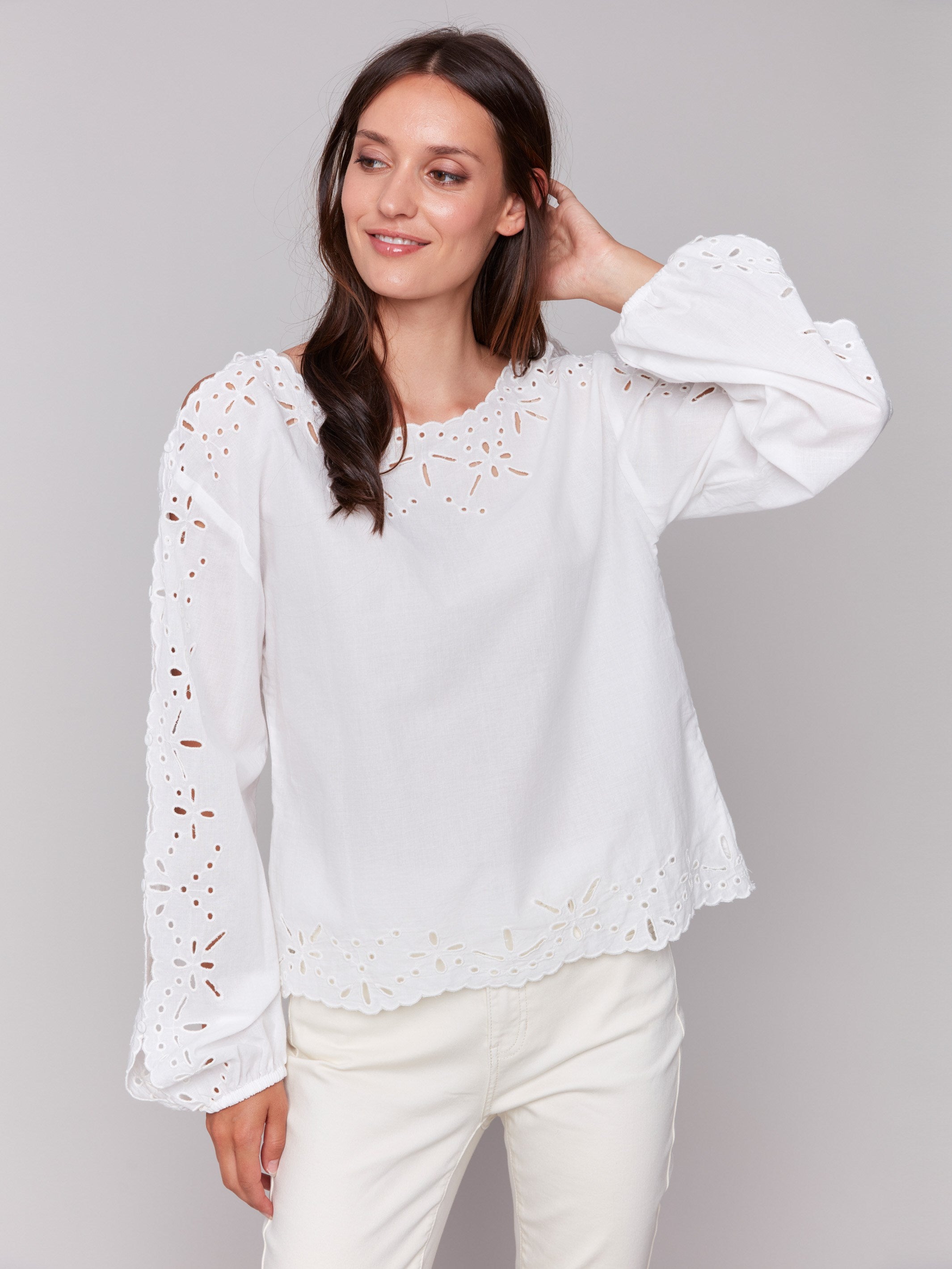 White blouse with balloon long sleeves and intricate design by Charlie B.