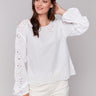 White blouse with balloon long sleeves and intricate design by Charlie B.