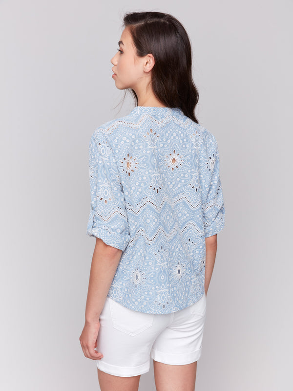 Chic blue blouse with 3/4 short sleeves and button tab detail by Charlie B.