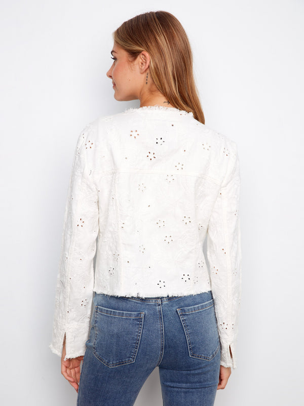 Elegant white denim jacket adorned with intricate embroidery and secured with a classic button front by Charlie B.
