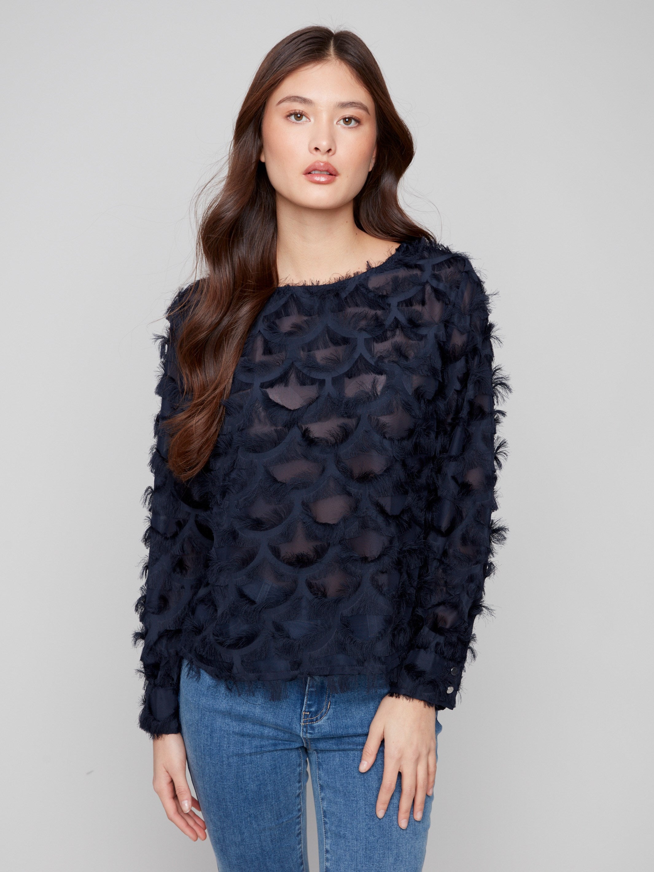 Navy blue chiffon blouse featuring a boat neck and elegant long sleeves, showcasing intricate details by Charlie B.