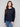 Navy blue chiffon blouse featuring a boat neck and elegant long sleeves, showcasing intricate details by Charlie B.