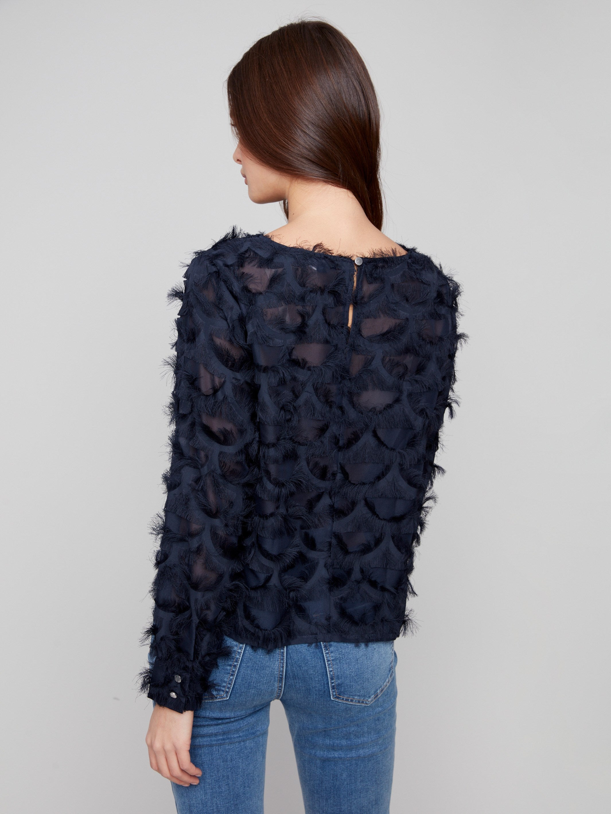 Sophisticated navy blue blouse with button cuffs and a delicate button closure at the back, crafted by Charlie B.