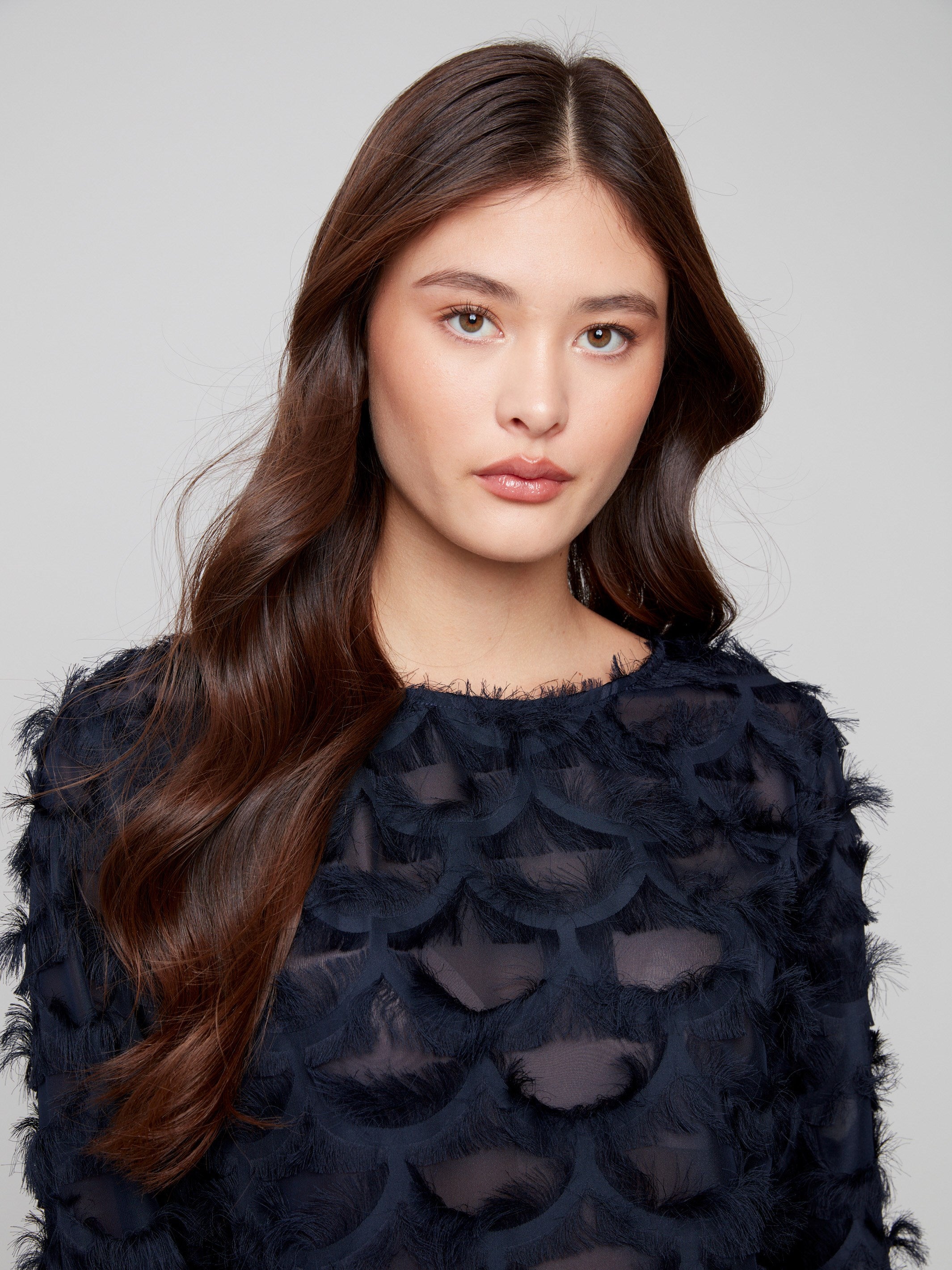 Fancy chiffon blouse in navy blue with textured patterns and stylish design elements for a chic look by Charlie B.
