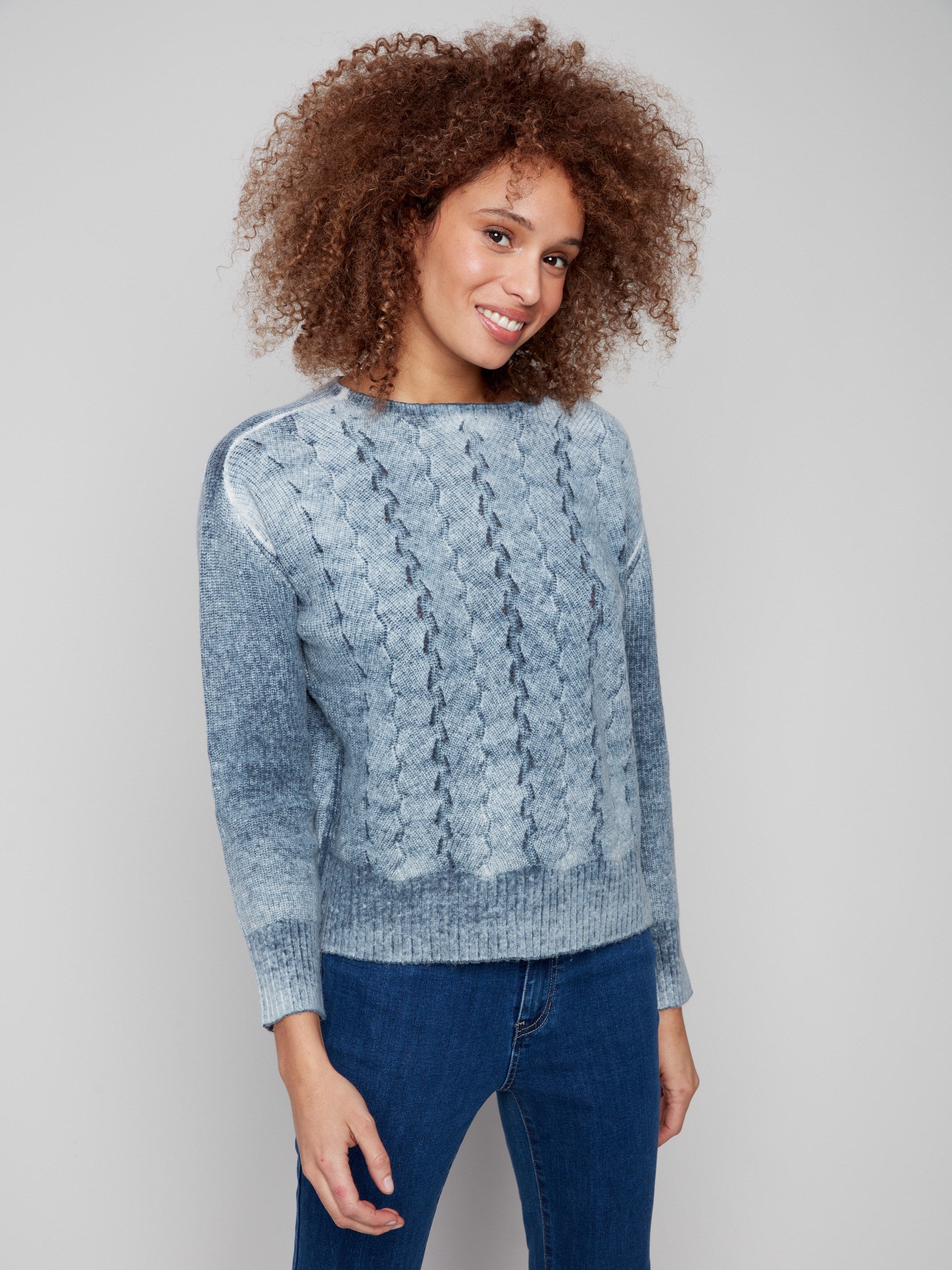 Blue denim sweater featuring drop shoulders and a ribbed hem, perfect for a casual look by Charlie B.