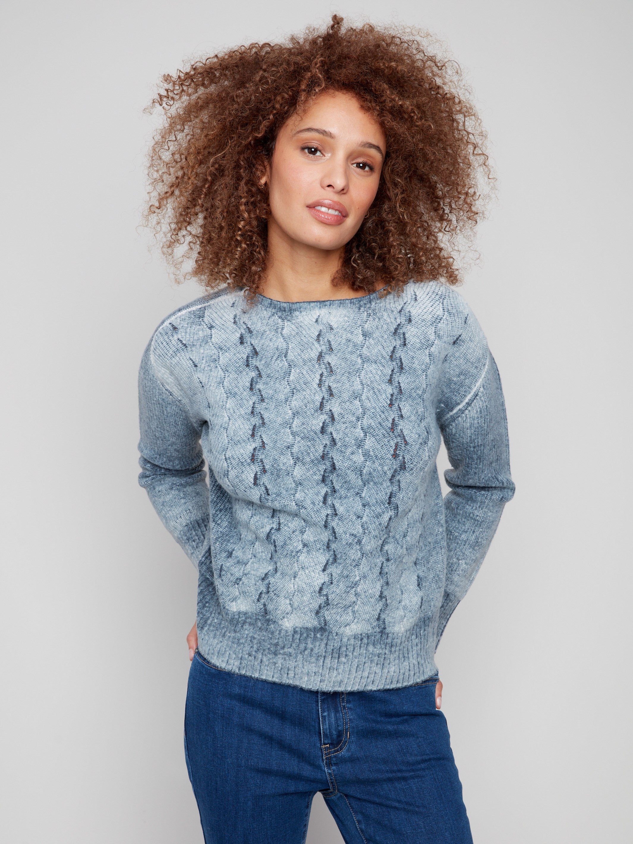 Cozy crew neck sweater in blue denim with ribbed cuffs, combining comfort and style effortlessly by Charlie B.