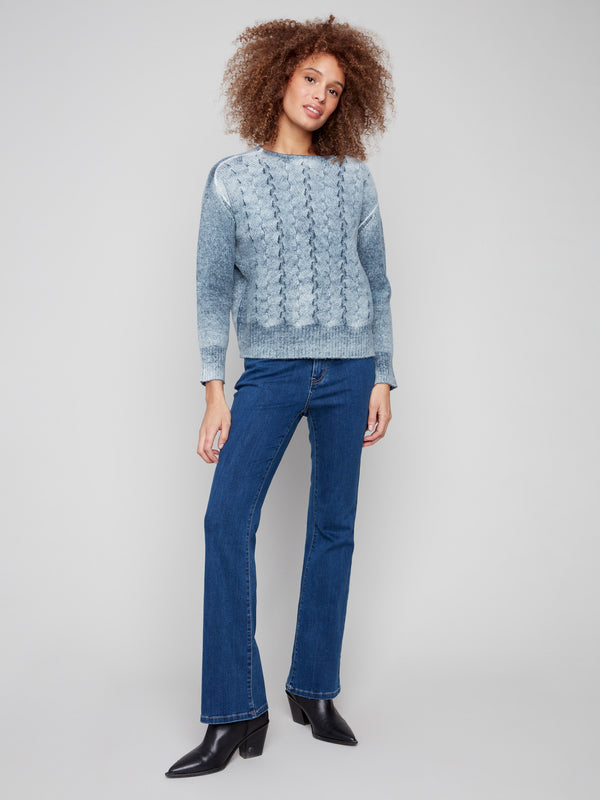 Chic cable knit blue sweater with ribbed details on the hem and cuffs for added texture by Charlie B.