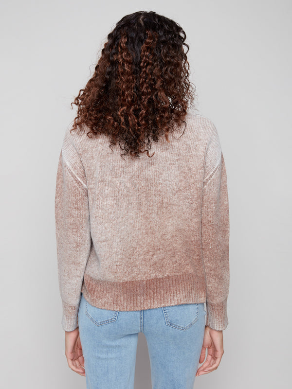 Comfortable cable knit sweater in sepia, designed with ribbed cuffs for added style by Charlie B.