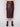 Sophisticated cabernet faux leather midi skirt with a slit front hem, styled with a beige top and brown boots by Charlie B.