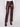 Long length cabernet faux leather pants with sleek detailing and back welt pockets by Charlie B.