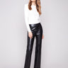 Black faux leather pants featuring a stylish straight fit and elegant design by Charlie B.