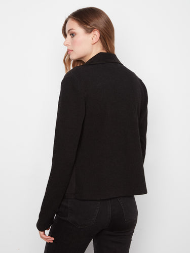 Black faux suede moto jacket featuring a stylish zip-front closure and elegant notched lapel collar, complete with zipper pockets by Charlie B.