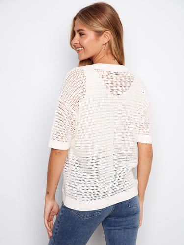 Chic fishnet pattern on this white top adds a unique touch to your everyday style by Charlie B.