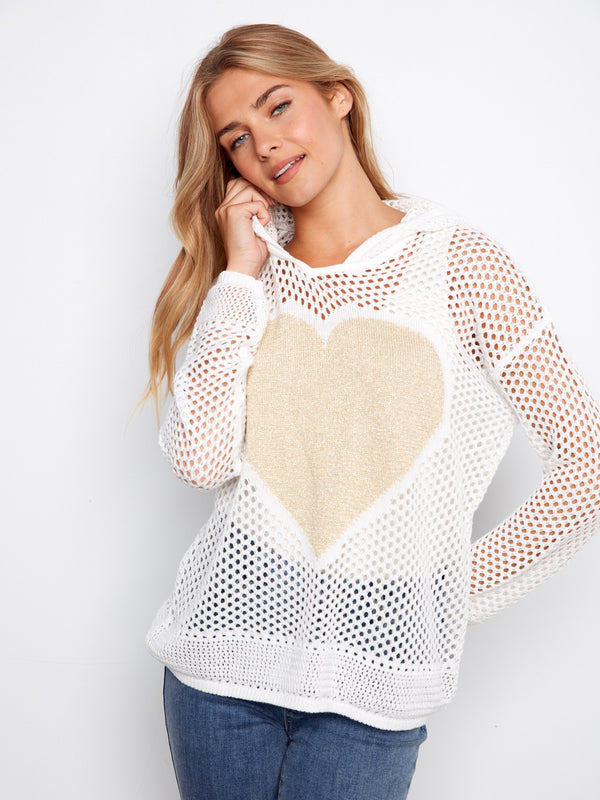 Embrace elegance with this white fishnet hoodie sweater, adorned with a charming golden heart motif. By Charlie B.