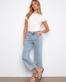 These jeans feature a flared leg design, adding a stylish touch to your outfit. Made with stretch denim for comfort by Charlie B.