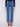 These jeans feature a long length, perfect for elongating the silhouette, paired with a chic top by Charlie B.