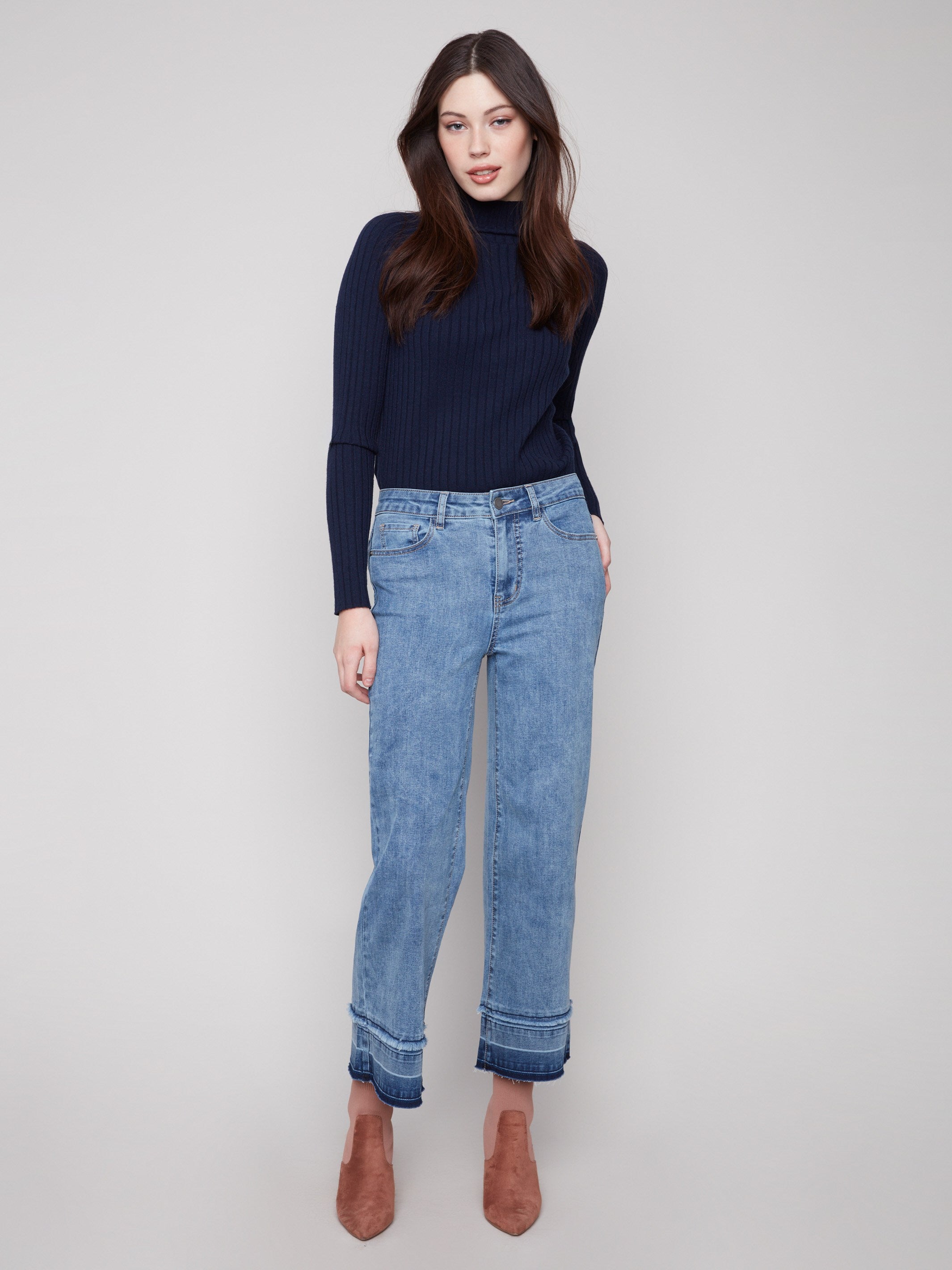 Medium blue jeans with a stylish flare fit, offering a chic look for any occasion by Charlie B.
