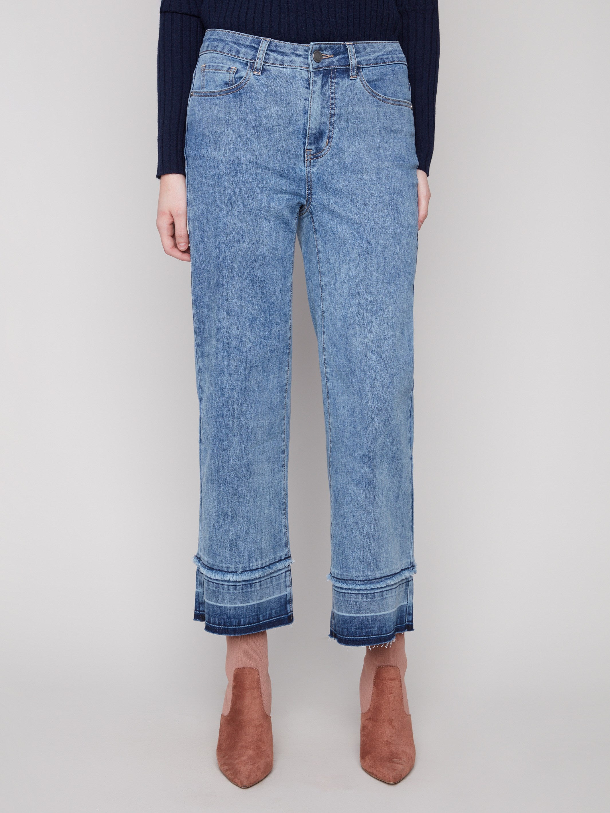 Cropped length medium blue jeans crafted from stretch denim material for comfort by Charlie B.