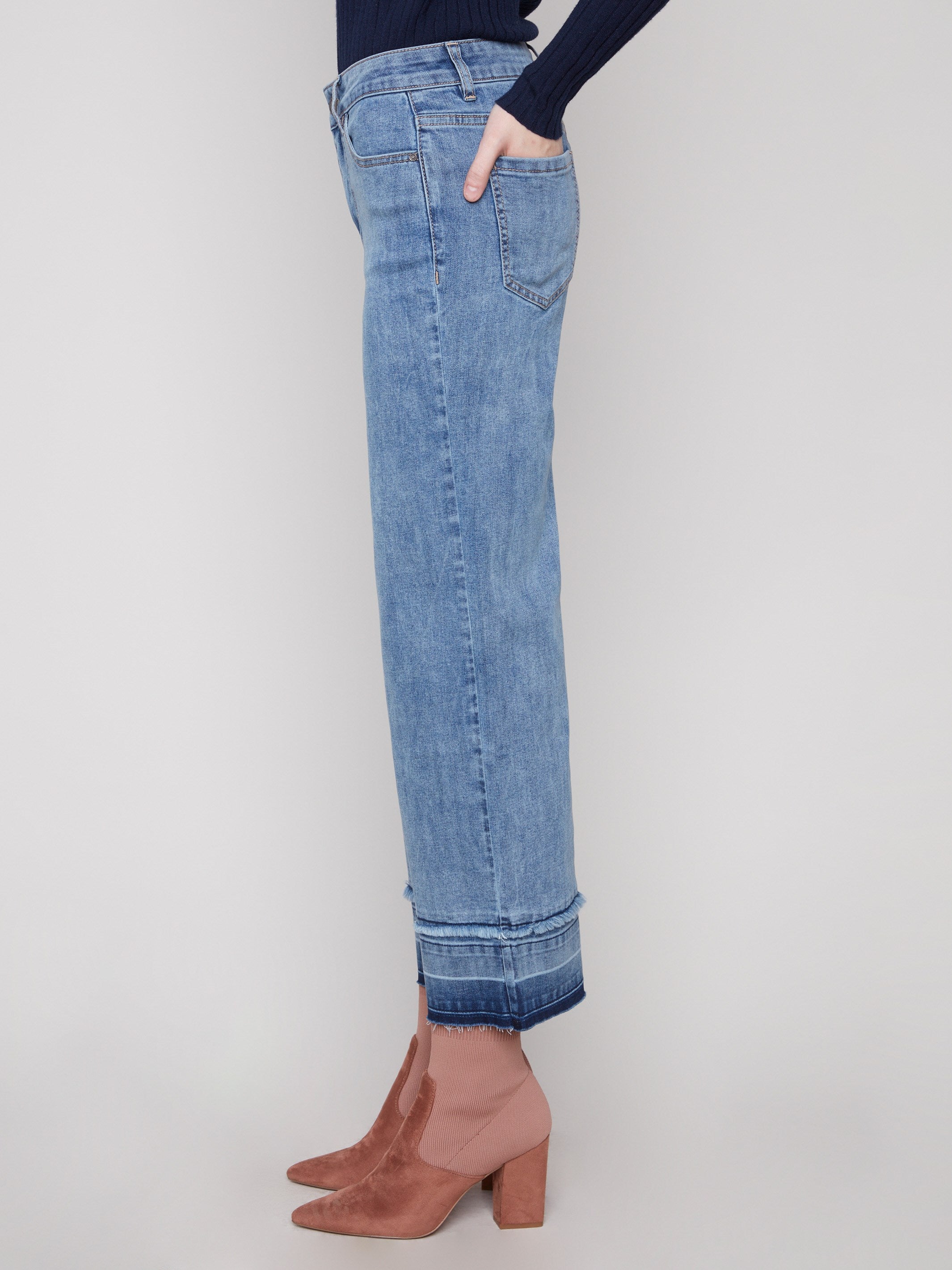 Jeans featuring fringe details at the hem in medium blue, enhancing their trendy appeal by Charlie B.