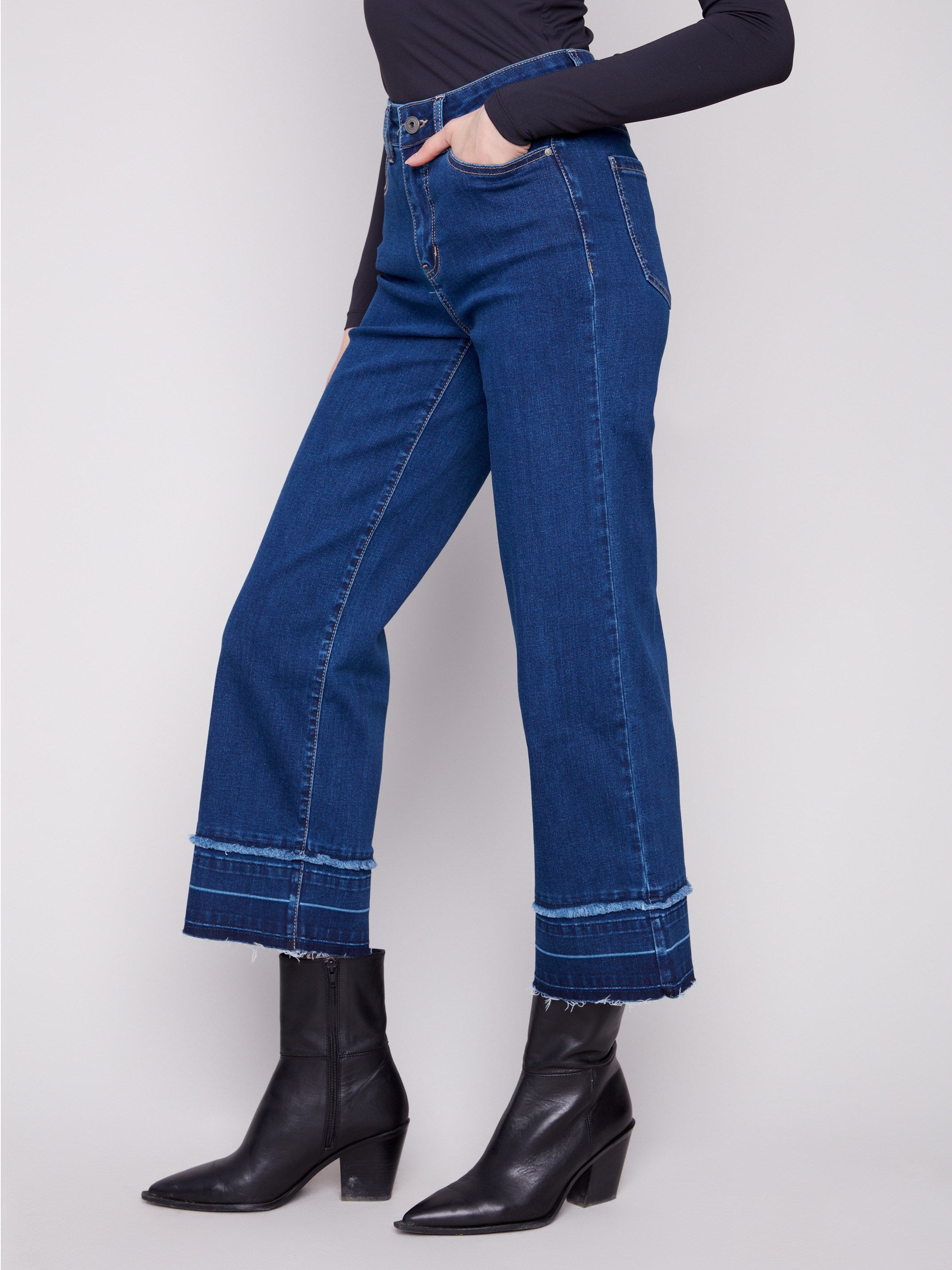 Five-pocket style indigo jeans in stretch denim material for comfort and flexibility by Charlie B.