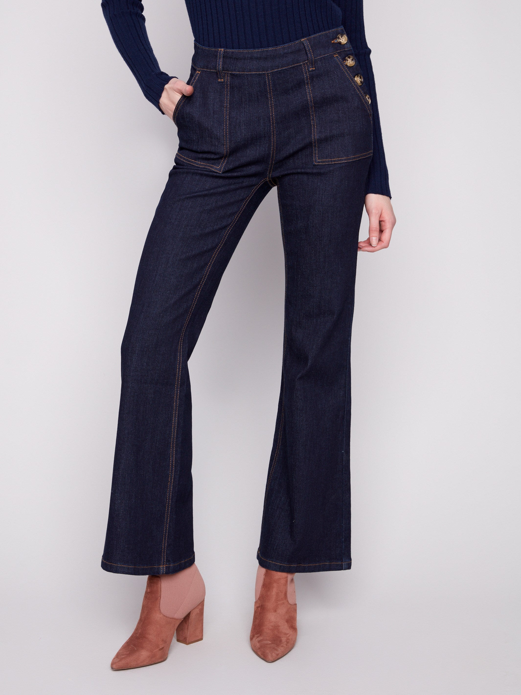 These long-length deep blue jeans come with patch pockets and a sophisticated design by Charlie B.