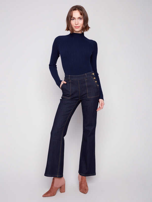 Classic deep blue jeans with a modern twist, showcasing elegant patch pockets for added flair by Charlie B.
